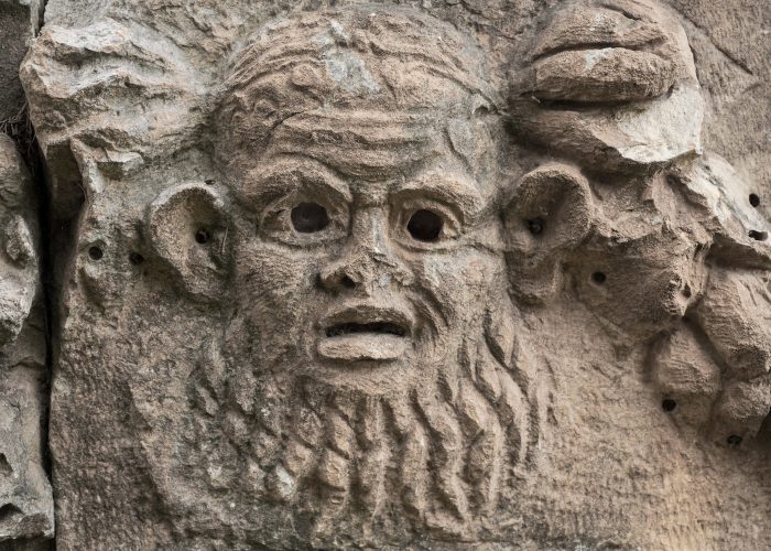 Theatrical mask, fragment of theater decoration with beautiful marble carving, history and heritage of ancient civilizations in the Aegean region of Turkey, vacation travel Theatrical mask, fragment of theater decoration with beautiful marble carving, history and heritage of ancient civilizations in the Aegean region of Turkey, vacation travel